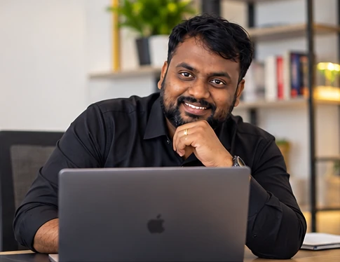 Veera Sanaka working at his desk